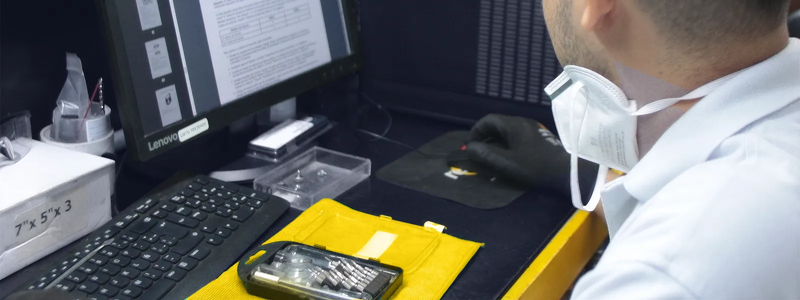 A Redsis technician at a configuration workstation